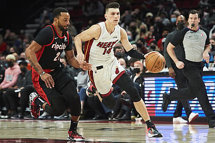 Jan 5, 2022; Portland, Oregon, USA;Miami Heat guard Tyler Herro (14) drives to the basket during the first half against Portland Trail Blazers forward Norman Powell (24) at Moda Center. Mandatory Credit: Troy Wayrynen-USA TODAY Sports