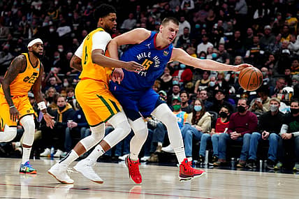 Jan 5, 2022; Denver, Colorado, USA; Utah Jazz forward Rudy Gay (8) defends on Denver Nuggets center Nikola Jokic (15) in the second half at Ball Arena. Mandatory Credit: Ron Chenoy-USA TODAY Sports