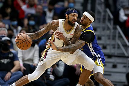 Jan 6, 2022; New Orleans, Louisiana, USA; New Orleans Pelicans forward Brandon Ingram (14) dribbles the ball while defended by Golden State Warriors guard Gary Payton II (0) in the second quarter at the Smoothie King Center. Mandatory Credit: Chuck Cook-USA TODAY Sports