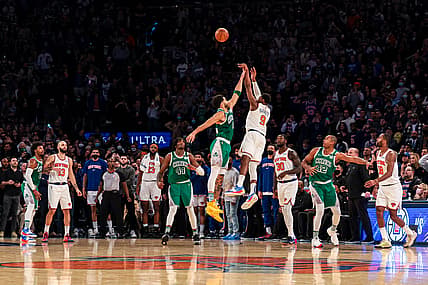 Jan 6, 2022; New York, New York, USA; New York Knicks guard RJ Barrett (9) makes a game-winning three point basket during the fourth quarter as Boston Celtics forward Jayson Tatum (0) defends at Madison Square Garden. Mandatory Credit: Vincent Carchietta-USA TODAY Sports