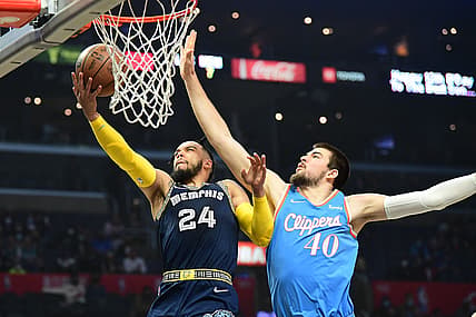 Jan 8, 2022; Los Angeles, California, USA; Memphis Grizzlies forward Dillon Brooks (24) moves to the basket against Los Angeles Clippers center Ivica Zubac (40) during the first half at Crypto.com Arena. Mandatory Credit: Gary A. Vasquez-USA TODAY Sports