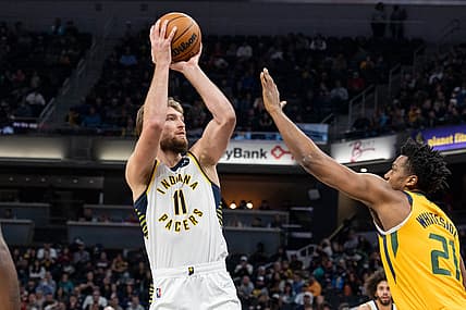 Jan 8, 2022; Indianapolis, Indiana, USA; Indiana Pacers forward Domantas Sabonis (11) shoots the ball while Utah Jazz center Hassan Whiteside (21) defends in the first half at Gainbridge Fieldhouse. Mandatory Credit: Trevor Ruszkowski-USA TODAY Sports