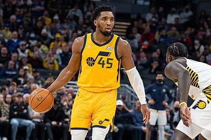 Jan 8, 2022; Indianapolis, Indiana, USA; Utah Jazz guard Donovan Mitchell (45) dribbles the ball while Indiana Pacers guard Lance Stephenson (6) defends in the second half at Gainbridge Fieldhouse. Mandatory Credit: Trevor Ruszkowski-USA TODAY Sports