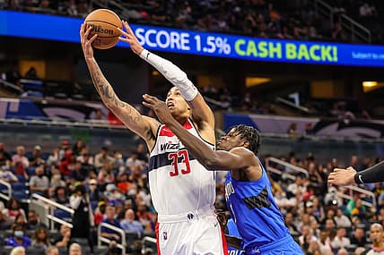 Jan 9, 2022; Orlando, Florida, USA; Washington Wizards forward Kyle Kuzma (33) goes to the basket against Orlando Magic center Mo Bamba (5) during the second quarter at Amway Center. Mandatory Credit: Mike Watters-USA TODAY Sports