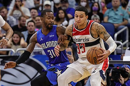 Jan 9, 2022; Orlando, Florida, USA; Orlando Magic guard Terrence Ross (31) guards Washington Wizards forward Kyle Kuzma (33) during the second half at Amway Center. Mandatory Credit: Mike Watters-USA TODAY Sports