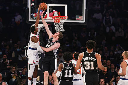 Jan 10, 2022; New York, New York, USA; San Antonio Spurs center Jakob Poeltl (25) blocks a shot by New York Knicks guard RJ Barrett (9) during the first half at Madison Square Garden. Mandatory Credit: Vincent Carchietta-USA TODAY Sports