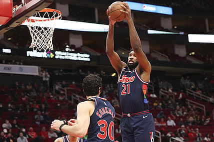 Jan 10, 2022; Houston, Texas, USA; Philadelphia 76ers center Joel Embiid (21) grabs a defensive rebound against the Houston Rockets  in the second quarter at Toyota Center. Mandatory Credit: Thomas Shea-USA TODAY Sports