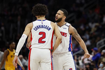 Jan 10, 2022; Detroit, Michigan, USA;  Detroit Pistons guard Cade Cunningham (2) receives congratulations from guard Cory Joseph (18) after he makes a three point basket in the second half against the Utah Jazz at Little Caesars Arena. Mandatory Credit: Rick Osentoski-USA TODAY Sports