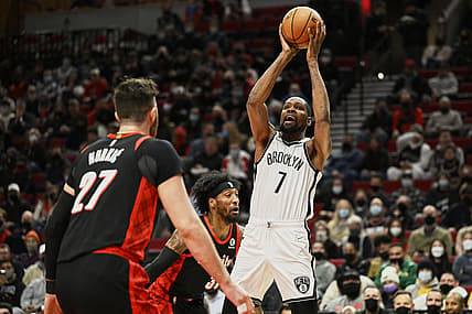Jan 10, 2022; Portland, Oregon, USA;  Brooklyn Nets forward Kevin Durant (7) shoots a basket during the first half against Portland Trail Blazers forward Robert Covington (33) at Moda Center. Mandatory Credit: Troy Wayrynen-USA TODAY Sports