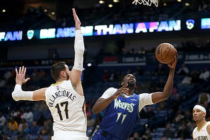 Jan 11, 2022; New Orleans, Louisiana, USA; Minnesota Timberwolves center Naz Reid (11) shoots the ball defended by New Orleans Pelicans center Jonas Valanciunas (17) in the second quarter  at the Smoothie King Center. Mandatory Credit: Chuck Cook-USA TODAY Sports