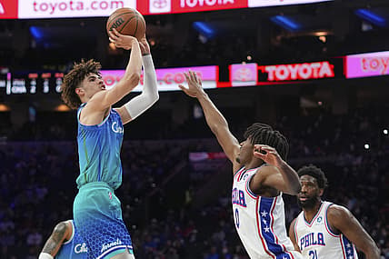 Jan 12, 2022; Philadelphia, Pennsylvania, USA; Charlotte Hornets guard LaMelo Ball (2) shoots the ball against Philadelphia 76ers guard Tyrese Maxey (0) in the first half at the Wells Fargo Center. Mandatory Credit: Mitchell Leff-USA TODAY Sports