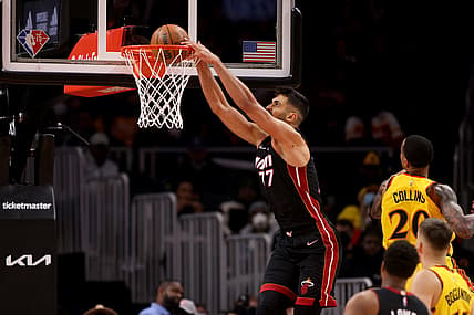 Jan 12, 2022; Atlanta, Georgia, USA; Miami Heat center Omer Yurtseven (77) dunks during the third quarter against the Atlanta Hawks at State Farm Arena. Mandatory Credit: Jason Getz-USA TODAY Sports