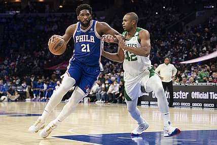 Jan 14, 2022; Philadelphia, Pennsylvania, USA; Philadelphia 76ers center Joel Embiid (21) dribbles the ball against Boston Celtics center Al Horford (42) during the first quarter at Wells Fargo Center. Mandatory Credit: Gregory Fisher-USA TODAY Sports