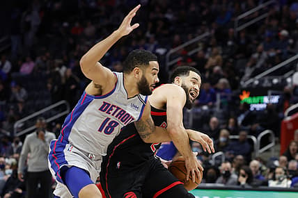 Jan 14, 2022; Detroit, Michigan, USA;  Toronto Raptors guard Fred VanVleet (23) is fouled by Detroit Pistons guard Cory Joseph (18) in the first half at Little Caesars Arena. Mandatory Credit: Rick Osentoski-USA TODAY Sports
