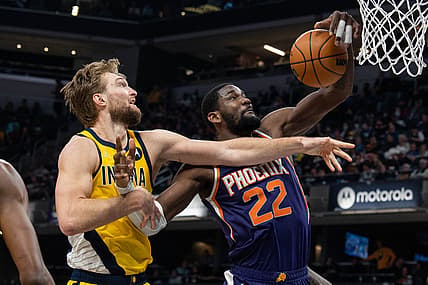 Jan 14, 2022; Indianapolis, Indiana, USA; Phoenix Suns center Deandre Ayton (22) rebounds the ball over Indiana Pacers forward Domantas Sabonis (11) in the second half at Gainbridge Fieldhouse. Mandatory Credit: Trevor Ruszkowski-USA TODAY Sports