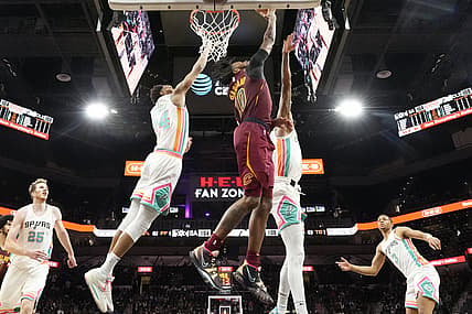 Jan 14, 2022; San Antonio, Texas, USA; Cleveland Cavaliers guard Darius Garland (10) shoots around San Antonio Spurs guard Devin Vassell (24) during the second half at AT&T Center. Mandatory Credit: Scott Wachter-USA TODAY Sports