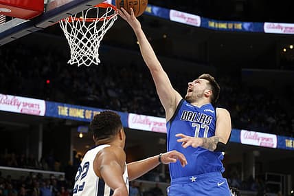 Jan 14, 2022; Memphis, Tennessee, USA; Dallas Mavericks guard Luka Doncic (77) shoots during the second half against the Memphis Grizzles at FedExForum. Mandatory Credit: Petre Thomas-USA TODAY Sports
