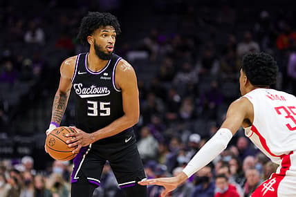 Jan 14, 2022; Sacramento, California, USA; Sacramento Kings forward Marvin Bagley III (35) controls the ball against Houston Rockets center Christian Wood (35) during the third quarter at Golden 1 Center. Mandatory Credit: Sergio Estrada-USA TODAY Sports
