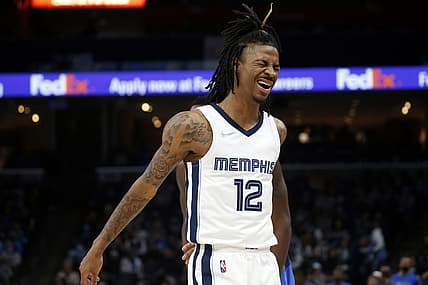 Jan 14, 2022; Memphis, Tennessee, USA; Memphis Grizzles guard Ja Morant (12) reacts during the second half against the Dallas Mavericks at FedExForum. Mandatory Credit: Petre Thomas-USA TODAY Sports