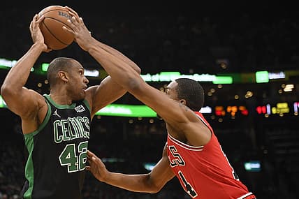 Jan 15, 2022; Boston, Massachusetts, USA; Boston Celtics center Al Horford (42) controls the ball while defended by Chicago Bulls forward Malcolm Hill (14) during the first half at TD Garden. Mandatory Credit: Bob DeChiara-USA TODAY Sports