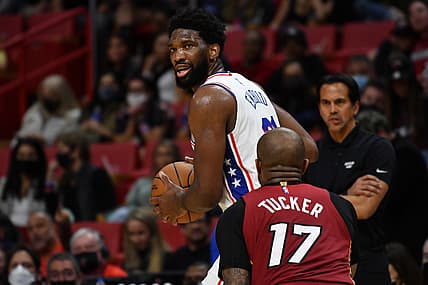 Jan 15, 2022; Miami, Florida, USA; Miami Heat forward P.J. Tucker (17) defends Philadelphia 76ers center Joel Embiid (21) during the second half at FTX Arena. Mandatory Credit: Jim Rassol-USA TODAY Sports