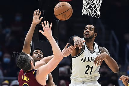 Jan 17, 2022; Cleveland, Ohio, USA; Brooklyn Nets center LaMarcus Aldridge (21) blocks the shot of Cleveland Cavaliers forward Kevin Love (0) during the first half at Rocket Mortgage FieldHouse. Mandatory Credit: Ken Blaze-USA TODAY Sports