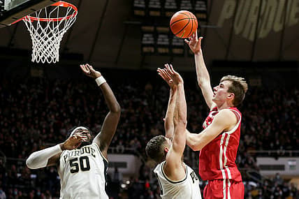 Wisconsin forward Tyler Wahl (5) goes up for a shot against Purdue forward Mason Gillis (0) and Purdue forward Trevion Williams (50) during the first half of an NCAA men's basketball game, Monday, Jan. 3, 2022 at Mackey Arena in West Lafayette.

Bkc Purdue Vs Wisconsin