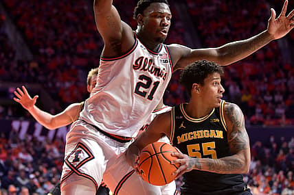 Jan 14, 2022; Champaign, Illinois, USA;  Michigan Wolverines guard Eli Brooks (55) looks to pass as Illinois Fighting Illini center Kofi Cockburn (21) defends during the second half at State Farm Center. Mandatory Credit: Ron Johnson-USA TODAY Sports