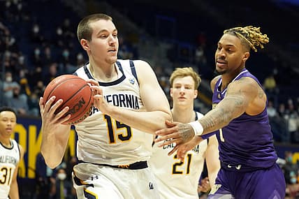 Feb 3, 2022; Berkeley, California, USA; California Golden Bears forward Grant Anticevich (15) secures a rebound while being defended by Washington Huskies forward Nate Roberts (1) during the first half at Haas Pavilion. Mandatory Credit: Darren Yamashita-USA TODAY Sports