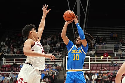 Feb 8, 2022; Stanford, California, USA; UCLA Bruins guard Tyger Campbell (10) shoots over Stanford Cardinal forward Spencer Jones (14) during the first half at Maples Pavilion. Mandatory Credit: Darren Yamashita-USA TODAY Sports