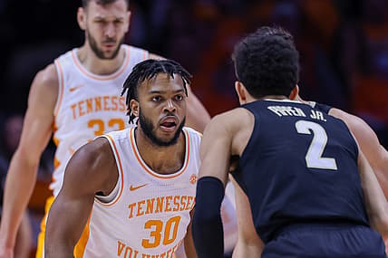 Feb 12, 2022; Knoxville, Tennessee, USA; Tennessee Volunteers guard Josiah-Jordan James (30) defends Vanderbilt Commodores guard Scotty Pippen Jr. (2) during the first half at Thompson-Boling Arena. Mandatory Credit: Randy Sartin-USA TODAY Sports