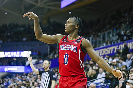 Feb 12, 2022; Seattle, Washington, USA; Arizona Wildcats guard Bennedict Mathurin (0) shoots a three-pointer against the Washington Huskies during the first half at Alaska Airlines Arena at Hec Edmundson Pavilion. Mandatory Credit: Joe Nicholson-USA TODAY Sports