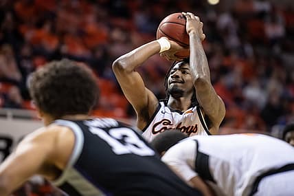 Feb 19, 2022; Stillwater, Oklahoma, USA; Oklahoma State Cowboys forward Kalib Boone (22) shoots a free throw against the Kansas State Wildcats during the first half at Gallagher-Iba Arena. Mandatory Credit: Rob Ferguson-USA TODAY Sports