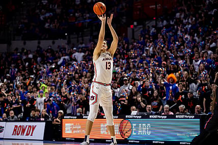 Feb 19, 2022; Gainesville, Florida, USA; Auburn Tigers forward Walker Kessler (13) shoots a three pointer during the first half against the Florida Gators at Billy Donovan Court at Exactech Arena. Mandatory Credit: Matt Pendleton-USA TODAY Sports