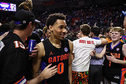 Feb 19, 2022; Gainesville, Florida, USA; Fan surround Florida Gators guard Myreon Jones (0) after the game against the Auburn Tigers at Billy Donovan Court at Exactech Arena. Mandatory Credit: Matt Pendleton-USA TODAY Sports