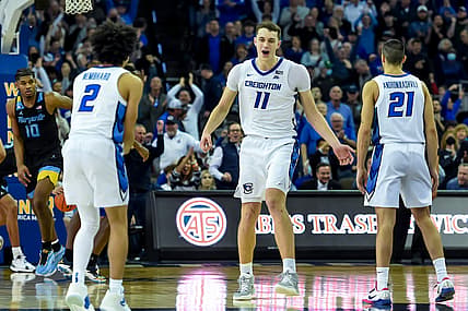 Feb 20, 2022; Omaha, Nebraska, USA;  Creighton Bluejays center Ryan Kalkbrenner (11) celebrates with guard Ryan Nembhard (2) and guard Rati Andronikashvili (21) after icing the game with a free throw against the Marquette Golden Eagles in the second half at CHI Health Center Omaha. Mandatory Credit: Steven Branscombe-USA TODAY Sports
