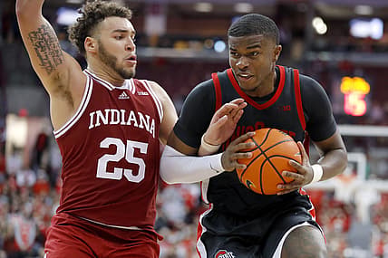 Feb 21, 2022; Columbus, Ohio, USA;  Ohio State Buckeyes forward E.J. Liddell (32) dribbles past Indiana Hoosiers forward Race Thompson (25) during the second half at Value City Arena. Mandatory Credit: Joseph Maiorana-USA TODAY Sports