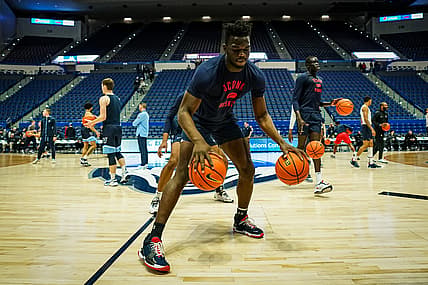 Feb 22, 2022; Hartford, Connecticut, USA; Connecticut Huskies forward Adama Sanogo (21) and teammates warm up before the start of the game against the Villanova Wildcats at XL Center. Mandatory Credit: David Butler II-USA TODAY Sports