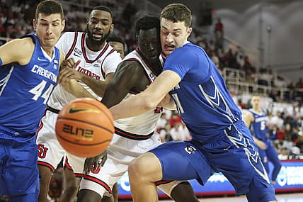 Feb 23, 2022; Queens, New York, USA;  St. John's Red Storm forward Esahia Nyiwe (22) and Creighton Bluejays center Ryan Kalkbrenner (11) fights for a loose ball in the first half at Carnesecca Arena. Mandatory Credit: Wendell Cruz-USA TODAY Sports
