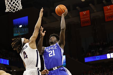 Feb 23, 2022; Charlottesville, Virginia, USA; Duke Blue Devils forward AJ Griffin (21) shoots the ball as Virginia Cavaliers guard Armaan Franklin (4) defends in the first half at John Paul Jones Arena. Mandatory Credit: Geoff Burke-USA TODAY Sports
