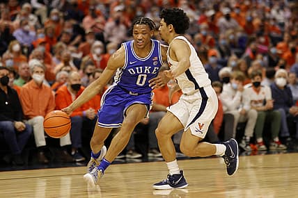 Feb 23, 2022; Charlottesville, Virginia, USA; Duke Blue Devils forward Wendell Moore Jr. (0) drives to the basket as Virginia Cavaliers guard Kihei Clark (0) defends in the first half at John Paul Jones Arena. Mandatory Credit: Geoff Burke-USA TODAY Sports