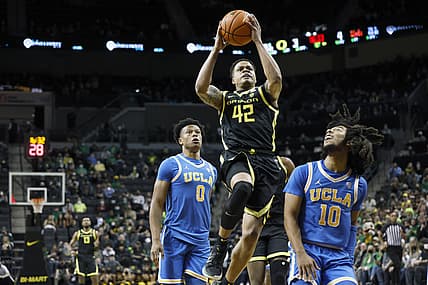 Feb 24, 2022; Eugene, Oregon, USA; Oregon Ducks guard Jacob Young (42) drives to the basket against UCLA Bruins guard Tiger Campbell (10) during the first half at Matthew Knight Arena. Mandatory Credit: Soobum Im-USA TODAY Sports