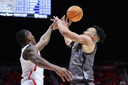 Feb 24, 2022; Salt Lake City, Utah, USA; Arizona Wildcats guard Bennedict Mathurin (0) knocks the ball out of the hand of Utah Utes guard Marco Anthony (10) in the first half at Jon M. Huntsman Center. Mandatory Credit: Rob Gray-USA TODAY Sports