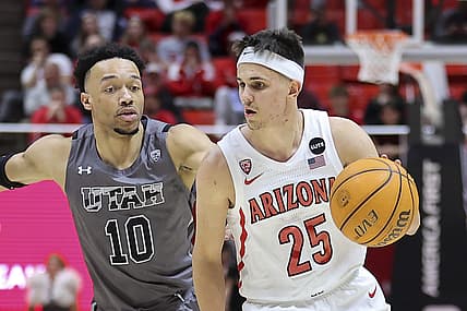 Feb 24, 2022; Salt Lake City, Utah, USA; Arizona Wildcats guard Kerr Kriisa (25) drives past Utah Utes guard Marco Anthony (10) in the second half at Jon M. Huntsman Center. Mandatory Credit: Rob Gray-USA TODAY Sports