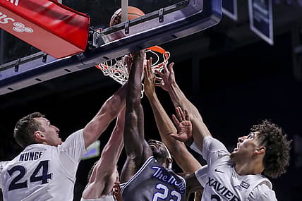 Feb 26, 2022; Cincinnati, Ohio, USA; Seton Hall Pirates guard Myles Cale (22) fights for a rebound against Xavier Musketeers forward Jack Nunge (24) and guard Colby Jones (3) in the first half at Cintas Center. Mandatory Credit: Katie Stratman-USA TODAY Sports
