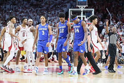 Feb 26, 2022; Fayetteville, Arkansas, USA; Arkansas Razorbacks look on as dejected Kentucky Wildcats guard TyTy Washington Jr. (3) and forwards Keion Brooks Jr. (12) and Oscar Tshiebwe (34) react after a foul call during the closing seconds of the game at Bud Walton Arena. Arkansas won 75-73. Mandatory Credit: Nelson Chenault-USA TODAY Sports