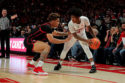 Feb 27, 2022; Houston, Texas, USA; Southern Methodist Mustangs guard Kendric Davis (3) handles the ball while Houston Cougars guard Ramon Walker Jr. (3) defends during the first half at Fertitta Center. Mandatory Credit: Erik Williams-USA TODAY Sports