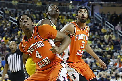 Feb 27, 2022; Ann Arbor, Michigan, USA;  Illinois Fighting Illini forward Omar Payne (4) and Iguard Jacob Grandison (3) box out Michigan Wolverines forward Moussa Diabate (14) in the first half at Crisler Center. Mandatory Credit: Rick Osentoski-USA TODAY Sports