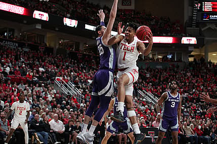 Feb 28, 2022; Lubbock, Texas, USA;  Texas Tech Red Raiders guard Terrence Shannon Jr. (1) goes to the basket against Kansas State Wildcats forward Ismael Massoud (25) int he first half at United Supermarkets Arena. Mandatory Credit: Michael C. Johnson-USA TODAY Sports