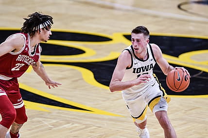 Feb 10, 2021; Iowa City, Iowa, USA; Iowa Hawkeyes guard Joe Wieskamp (10) controls the ball as Rutgers Scarlet Knights guard Caleb McConnell (22) defends during the first half at Carver-Hawkeye Arena. Mandatory Credit: Jeffrey Becker-USA TODAY Sports